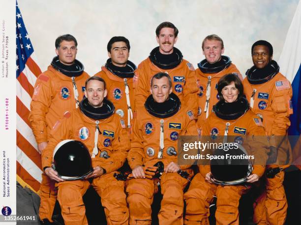 Astronauts and one cosmonaut represent the flight crew for the STS-89 mission to Russia's Space Station Mir, 1998; on the front row, from the left,...