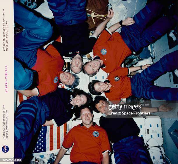 Crew inflight portrait on the middeck during NASA Mission STS-91, 2nd-12th June 1998; Starburst pattern clockwise top: Mission specialist Valery...