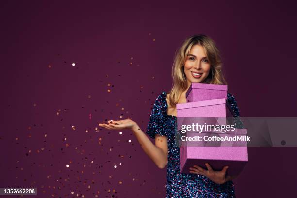 beautiful emotional woman holding gift container - woman birthday stock pictures, royalty-free photos & images