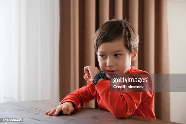 4-5 years old child using smart watch - turkey hunting stock pictures, royalty-free photos & images