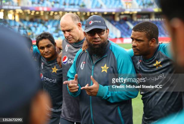 Saqlain Mushtaq, Head Coach of Pakistan interacts with their side in the huddle ahead of the ICC Men's T20 World Cup semi-final match between...