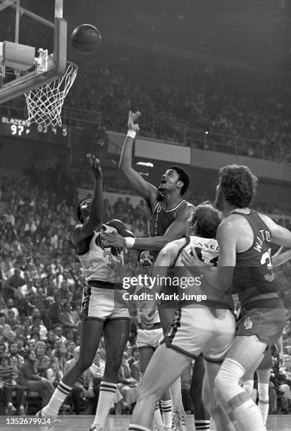 Portland Trail Blazers forward Maurice Lucas flips the ball toward the hoop during an NBA playoff game against the Denver Nuggets at McNichols Arena...