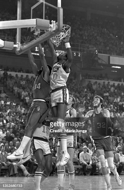 Denver Nuggets center Marvin Webster blocks a layup attempt by Portland Trail Blazers point guard Lionel Hollins during an NBA playoff game at...