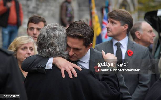 Kim Devonshire, partner of Dennis Hutchings is consoled by Johnny Mercer, MP for Plymouth Moor View, after a funeral service at St Andrew's Church on...