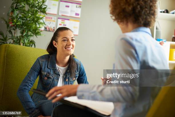 young woman in counselling session - student advisor stock pictures, royalty-free photos & images