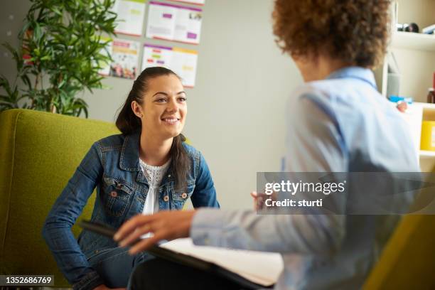 young woman in counselling session - youth worker stock pictures, royalty-free photos & images