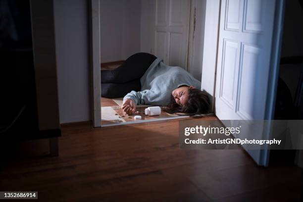 woman committing suicide at home by overdose. suicide consept - dead women stock pictures, royalty-free photos & images