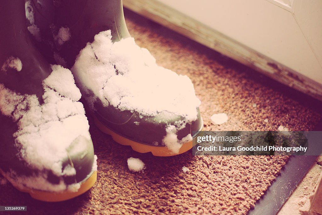 Snow on wellies by back door