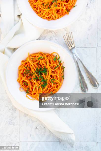 pasta with red pepper sauce - roasted pepper stock pictures, royalty-free photos & images