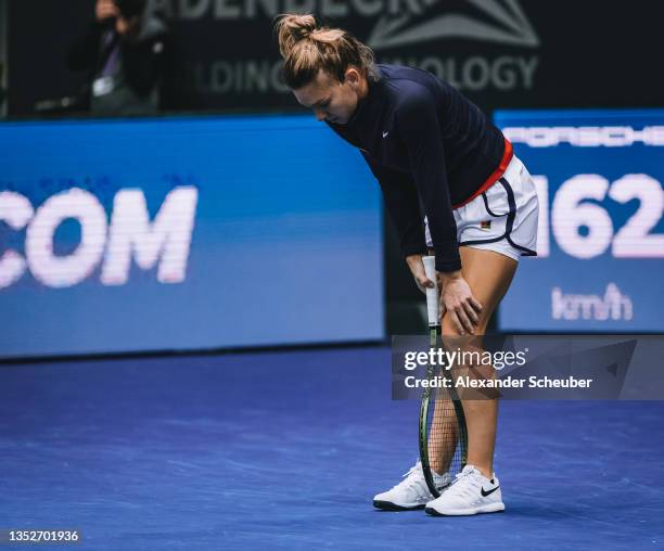 Simona Halep of Romania reacts and holds her knee during the WTA Upper Austria Ladies Linz quarter-finals on November 10, 2021 in Linz, Austria.