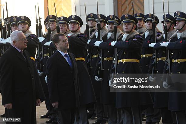 Russian President Dmitry Medvedev , followed by Czech President Vaclav Claus arrive during a visit to the city on December 8 ,2011 in Prague, Czech...