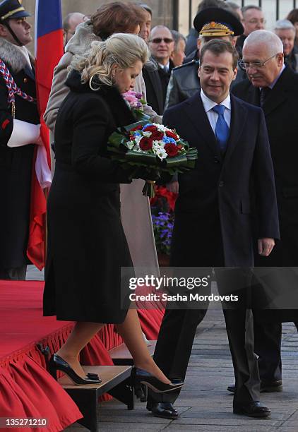 Russian President Dmitry Medvedev , his spouse Svetlana Medvedeva followed by Czech President Vaclav Claus arrive for a meeting on December 8 ,2011...