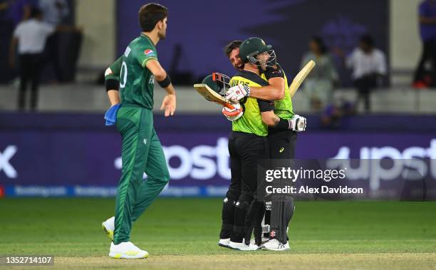 Matthew Wade of Australia celebrates with Marcus Stoinis of Australia following the ICC Men's T20 World Cup semi-final match between Pakistan and...