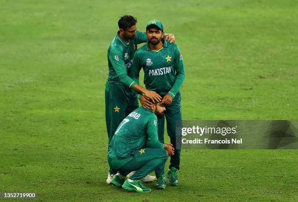 Shoaib Malik, Babar Azam and Shadab Khan of Pakistan react following the ICC Men's T20 World Cup semi-final match between Pakistan and Australia at...