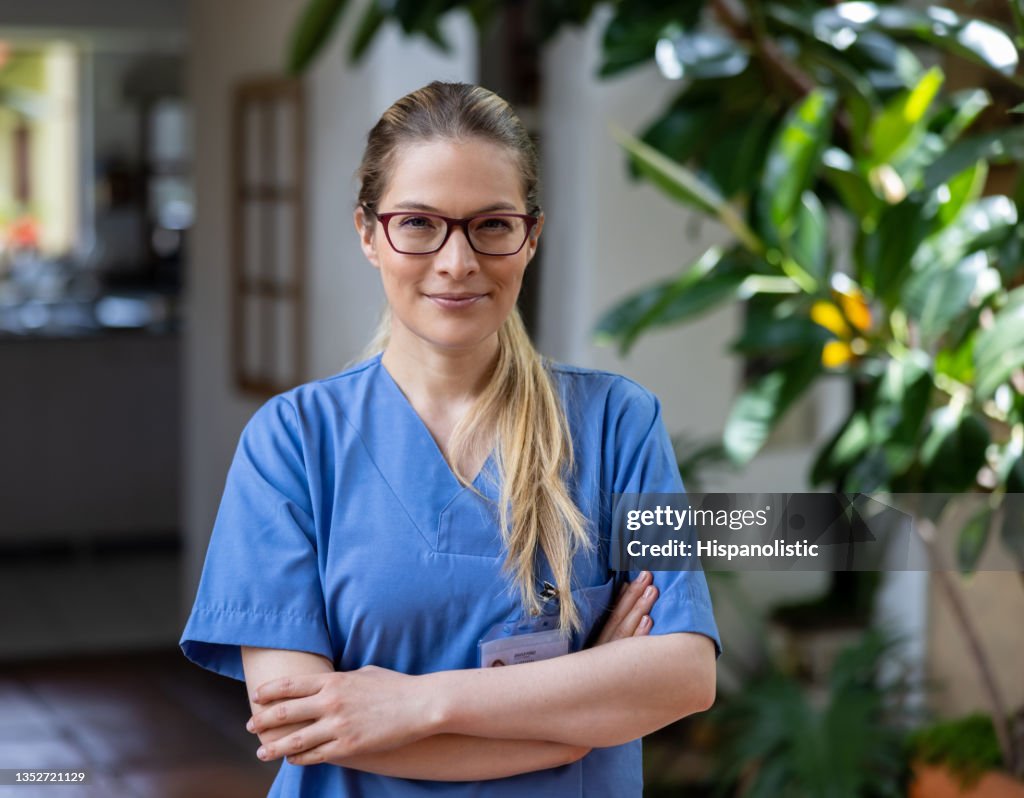 Home caregiver working at the house of a patient