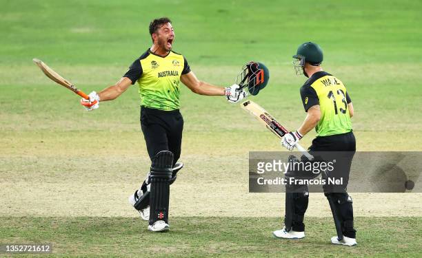 Matthew Wade of Australia celebrates with Marcus Stoinis of Australia following the ICC Men's T20 World Cup semi-final match between Pakistan and...
