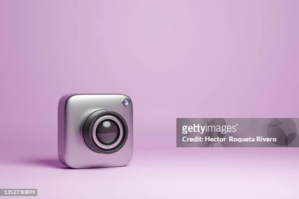 3d render of metal camera on purple background - 3d object stock pictures, royalty-free photos & images