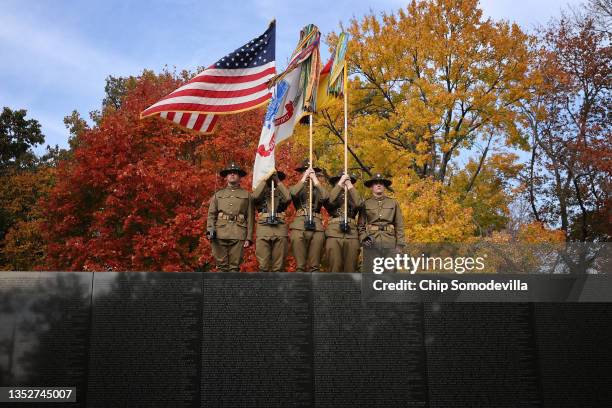 An honor guard from the U.S. Army 1st Cavalry Division stands along the top of the Vietnam Veterans Memorial during Veterans Day observances on the...