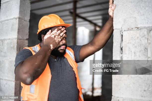 exhausted construction worker at construction site - mistaken identity stock pictures, royalty-free photos & images