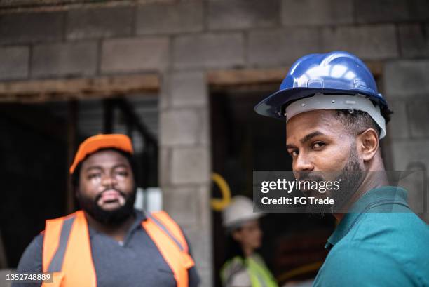 portrait of coworkers in a construction site - no emotion stock pictures, royalty-free photos & images