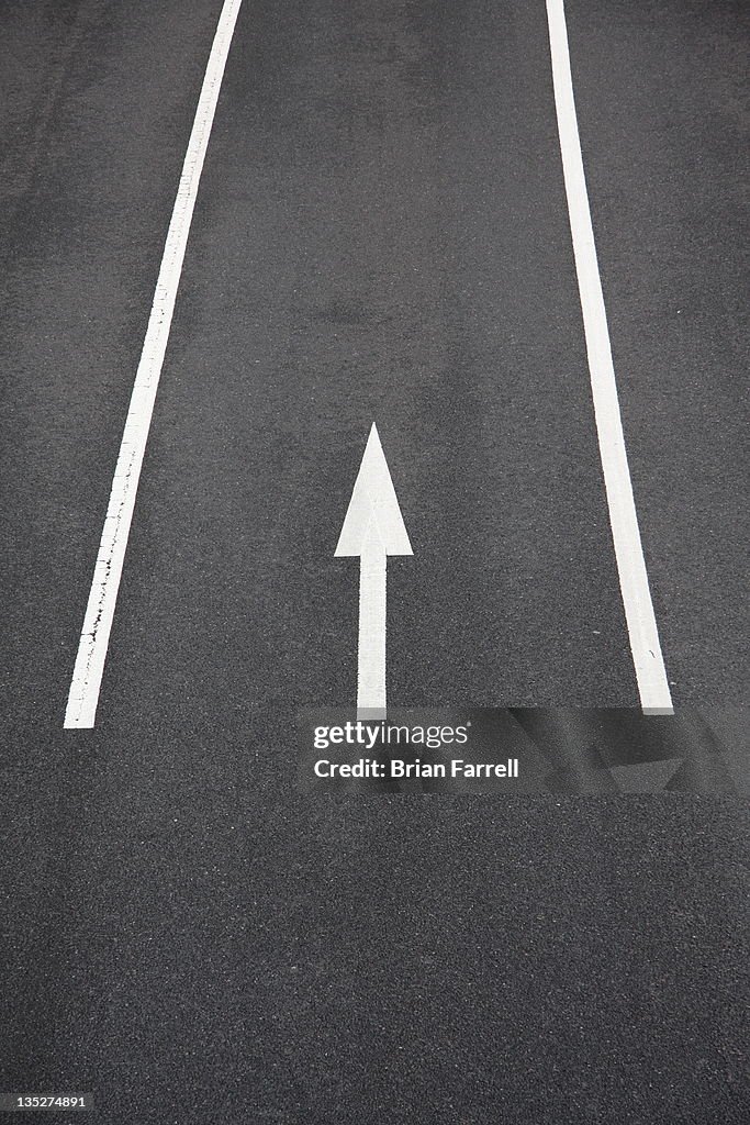 White arrow on road