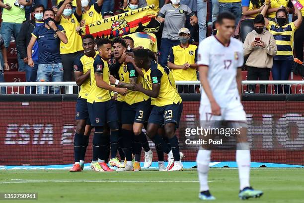 Piero Hincapie of Ecuador celebrates with teammates after scoring the first goal of his team during a match between Ecuador and Venezuela as part of...