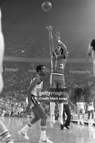 Portland Trail Blazers guard Herm Gilliam shoots a jump shot over guard Ted McClain during an NBA playoff game against the Denver Nuggets at...