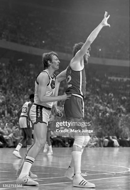 Dan Issel of the Denver Nuggets guards Bill Walton during an NBA playoff game against the Portland Trail Blazers at McNichols Arena on APRIL 20, 1977...