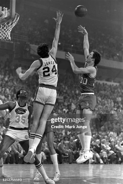 Portland Trail Blazers forward Bob Gross shoots a floater over forward Bobby Jones during an NBA playoff game against the Denver Nuggets at McNichols...