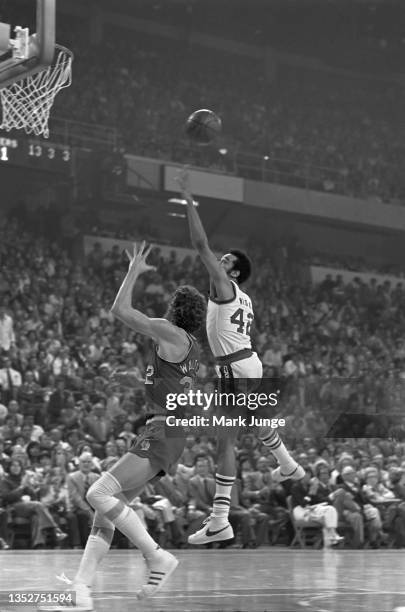 Willie Wise of the Denver Nuggets tries to steal a pass to Bill Walton in an NBA playoff game against the Portland Trail Blazers at McNichols Arena...