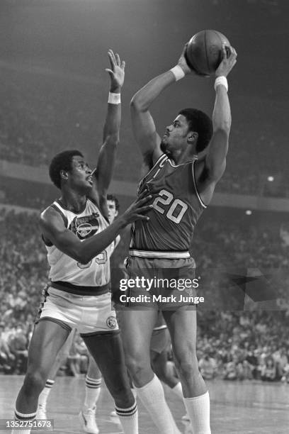 Portland Trail Blazers forward Maurice Lucas shoots a fade-away jumper over Paul Silas during an NBA playoff game against the Denver Nuggets at...