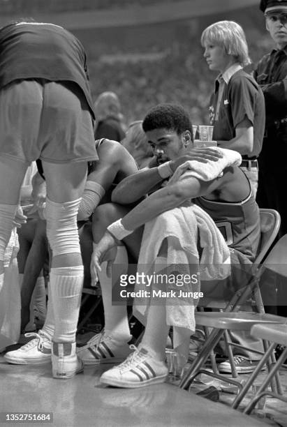 Portland Trail Blazers forward Maurice Lucas sits on the players bench in a mood of contemplation during an NBA playoff game against the Denver...