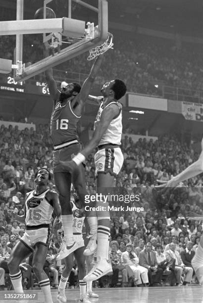 Denver Nuggets center Marvin Davis attempts to block a Johnny Davis layup during an NBA playoff game against the Portland Trail Blazers at McNichols...