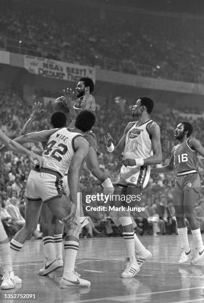 Portland Trail Blazers point guard Lionel Hollins is caught in midair during an NBA playoff game against the Denver Nuggets at McNichols Arena on...