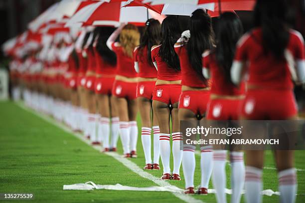 Cheerleaders of Colombia's Independiente Santa Fe stand in the field before the Copa Sudamericana quarterfinal football match against Argentina's...