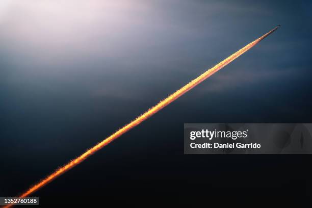 flying plane and its wake. aircraft background. space rocket.travel and vacation - vapour trail stock pictures, royalty-free photos & images