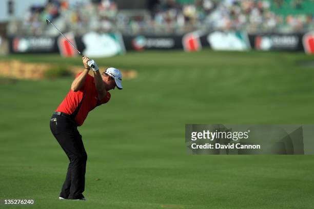 Peter Hanson of Sweden plays his second shot at the par 5, 18th hole during the first round of the Dubai World Championship on the Earth Course at...