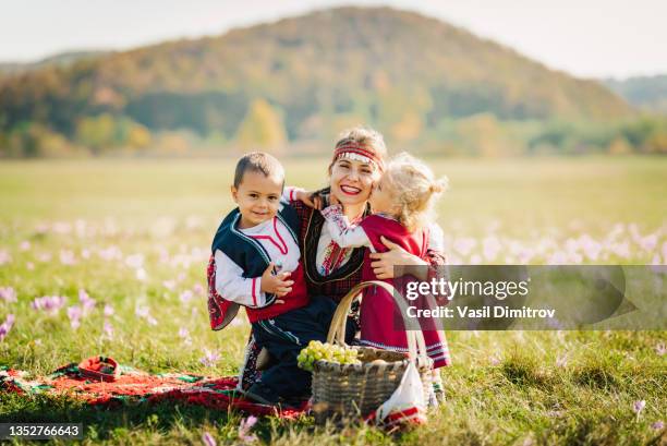 family in traditional bulgarian costumes. - bulgaria landmark stock pictures, royalty-free photos & images