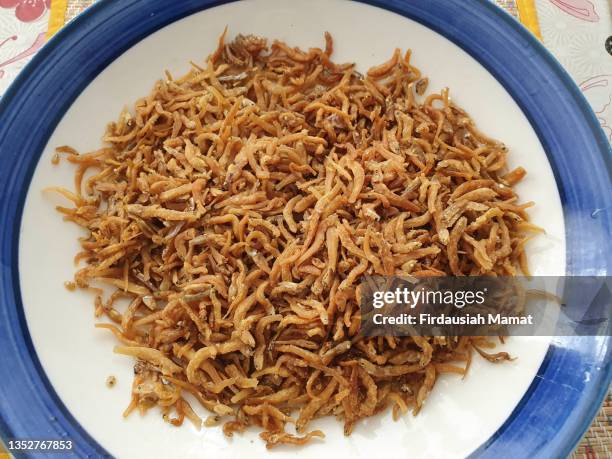 close up of freshly fried crunchy anchovies - dried fish stock pictures, royalty-free photos & images