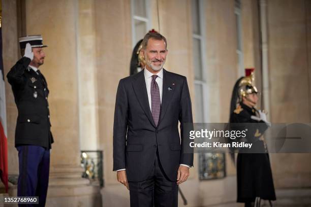 King Felipe VI of Spain arrives at the Élysée Palace for the inaugural dinner of the Paris Peach Forum as World Leaders and dignitaries arrive in...
