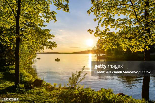 scenic view of lake against sky during sunset,tampere,finland - tampere foto e immagini stock