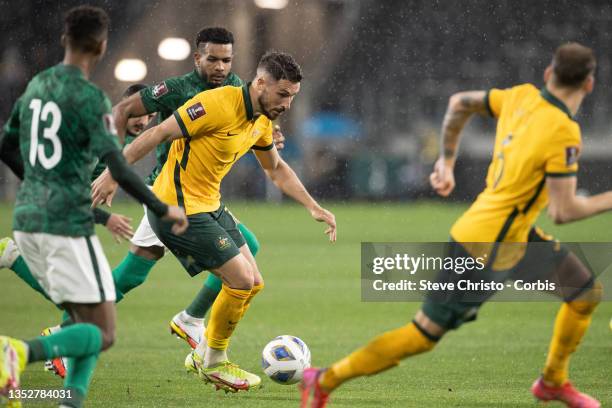 Mathew Leckie of Australia takes on the Saudi defence during the FIFA World Cup AFC Asian Qualifier match between the Australia Socceroos and Saudi...