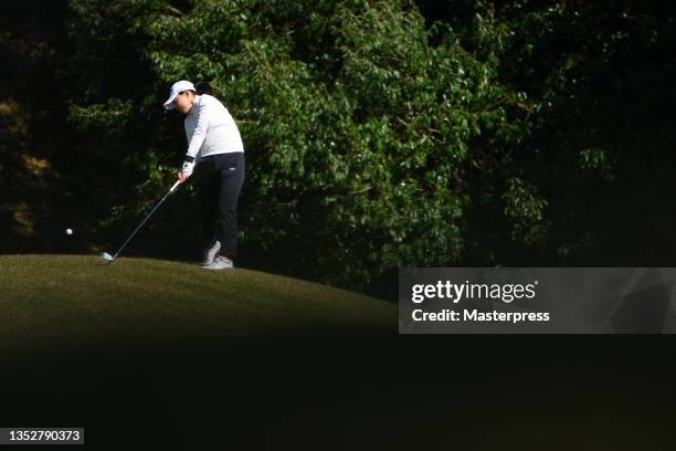 Sakura Yokomine of Japan hits her second shot on the 11th hole during the first round of the Ito-En Ladies at the Great Island Club on November 12,...