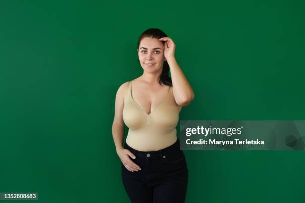 plus size woman near a green wall. - leopard silhouette stock pictures, royalty-free photos & images