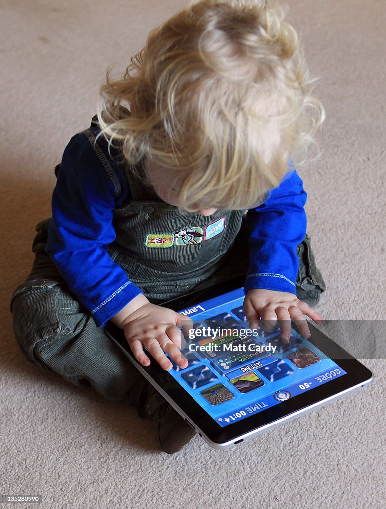 Children Interacting With Tablet Technology