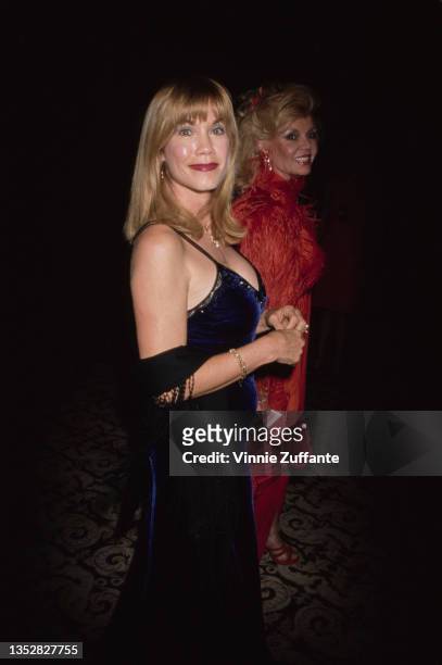 American singer and actress Barbi Benton, wearing a blue velvet evening gown, attends the 'One Giant Leap for Humanity' benefit for National...