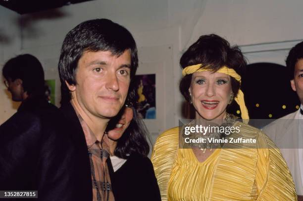 French film director Jean-Jacques Beineix, wearing a dark blazer over a check shirt, and American actress and singer Ruth Warrick , wearing a yellow...