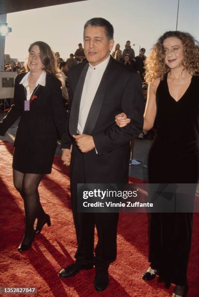 Mexican-American actor Robert Beltran and two women attend the 2nd Annual Screen Actors Guild Awards, held at the Santa Monica Civic Auditorium in...