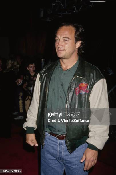 American actor and comedian Jim Belushi wearing a 'Planet Hollywood' jacket, 1994.