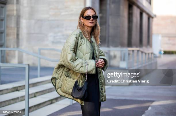 Anna Winter is seen wearing green Frankie Shop jacket, black vest &other stories, Filippa K pants, Prada bag, shoes, Prada sunglasses on November 11,...